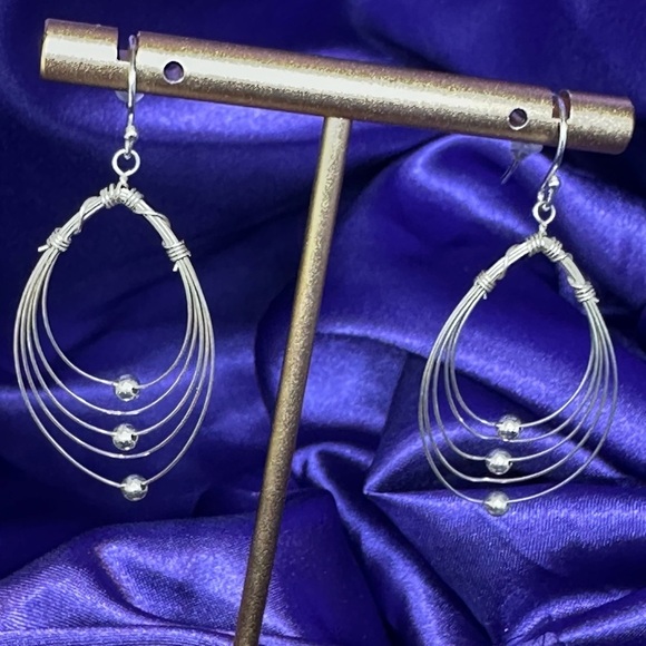 Multi Hoops with moving silver balls dangle earrings. - Picture 1 of 12
